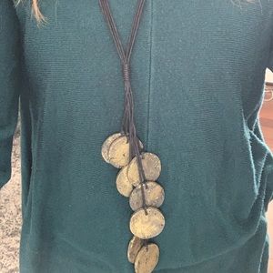 Long necklace-black cording. Very unique.